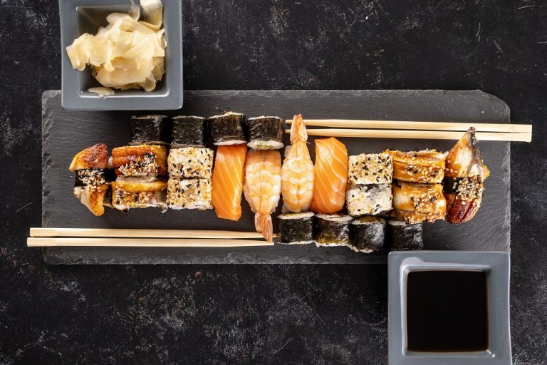 sushi-plate-dark-stone-chopsticks-black-background-studio-healthy-asian-food (1)